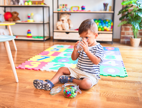 Toddler drinking water at a day care facility