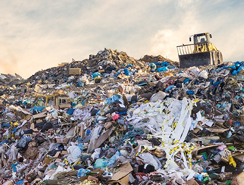 A large pile of plastic waste in a landfill