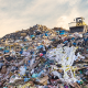 A large pile of plastic waste in a landfill