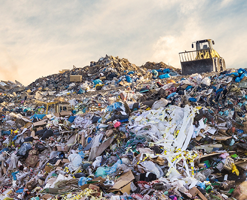 A large pile of plastic waste in a landfill
