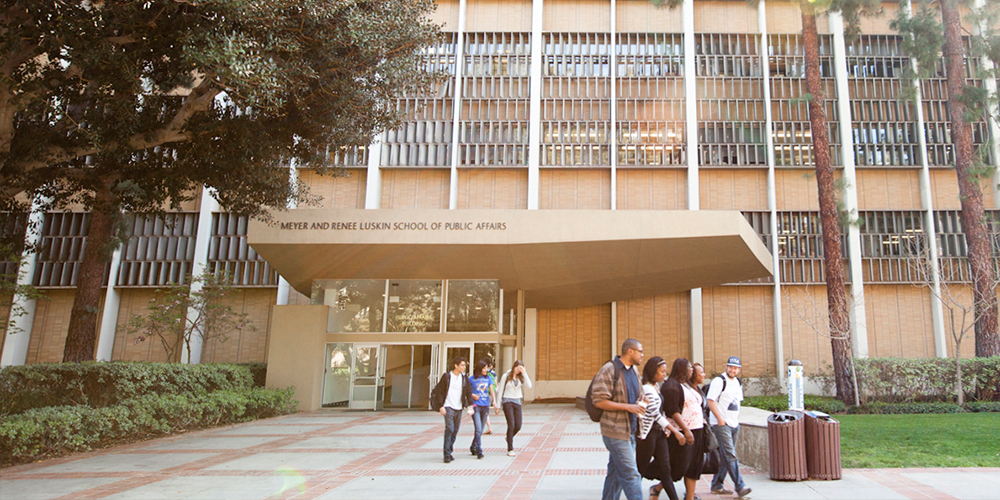 Students walking in front of the UCLA Luskin School of Public Affairs