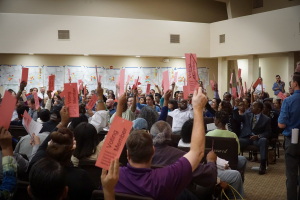 Residents vote at a TCC community meeting in Fresno, CA—one of the first grantee communities.