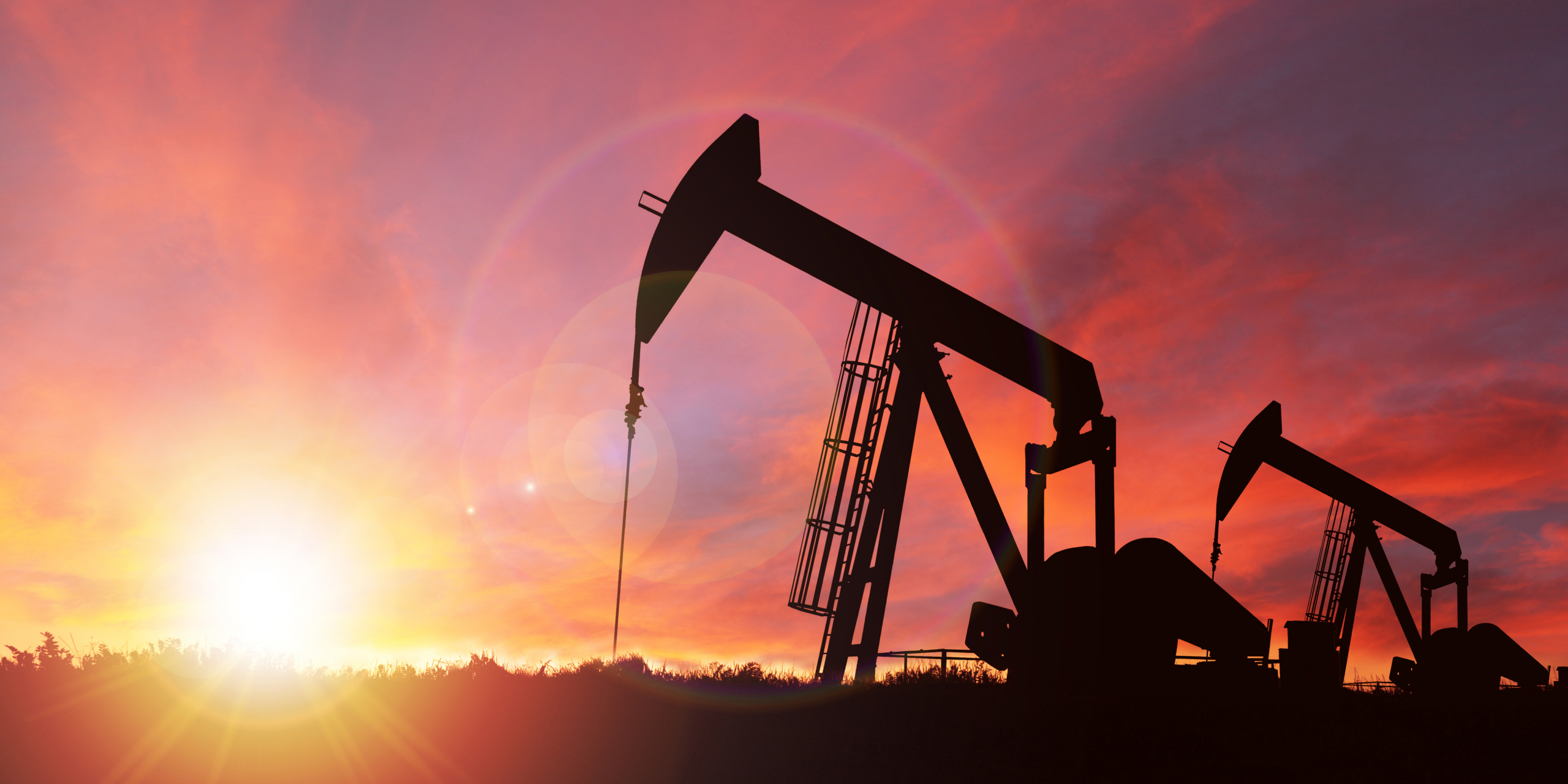 Sunset Over Pumpjack Silhouette With Copy Space
