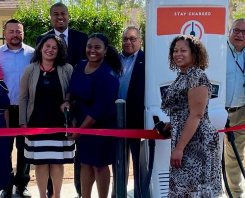 Keshia Thomas celebrates new electric vehicle charging infrastructure installed at an affordable housing site in southwest Fresno.
