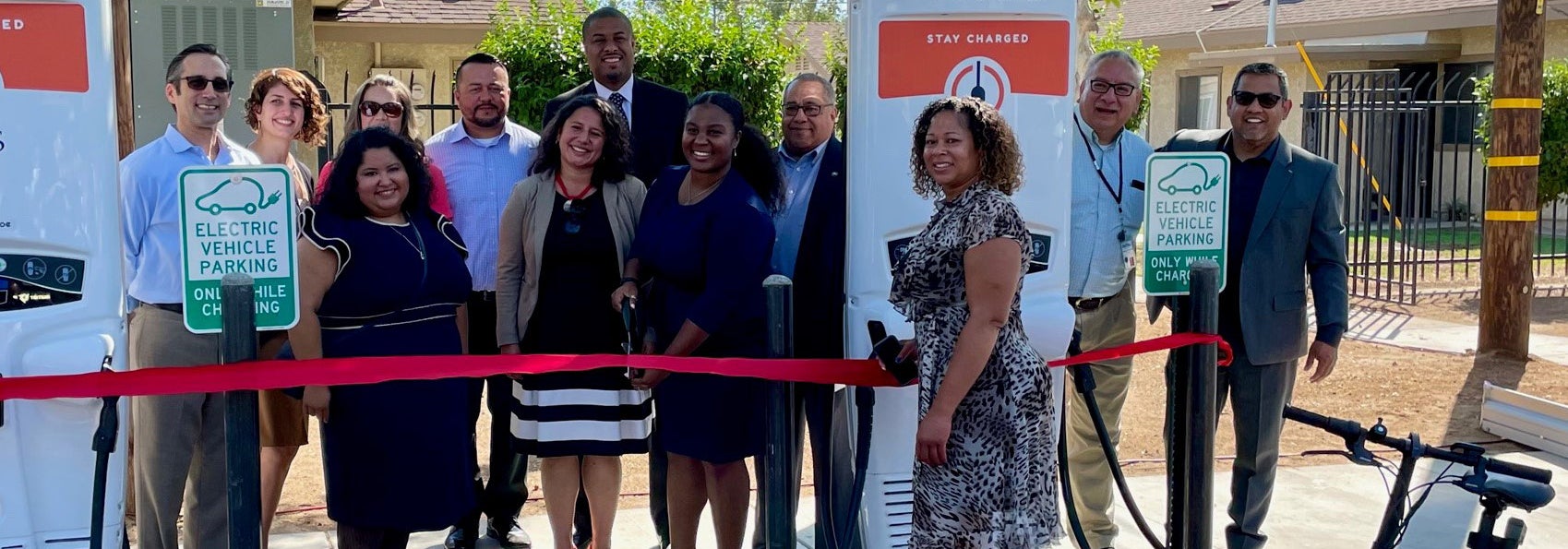 Keshia Thomas celebrates new electric vehicle charging infrastructure installed at an affordable housing site in southwest Fresno.