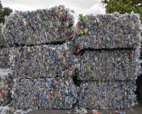 Bales of crushed plastic beverage bottles at a recycling facility in San Jose, California